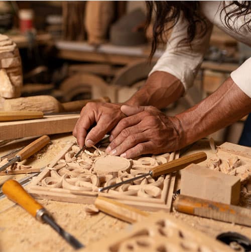 Hands carving wood - artisan at work