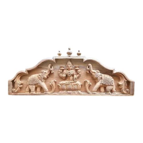 Hand-carved sacred elephants flanking Gajalakshmi on South Indian teak wood Gopuram wall panel